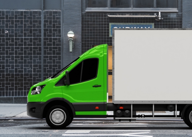 Driver operating truck controls during international freight transport