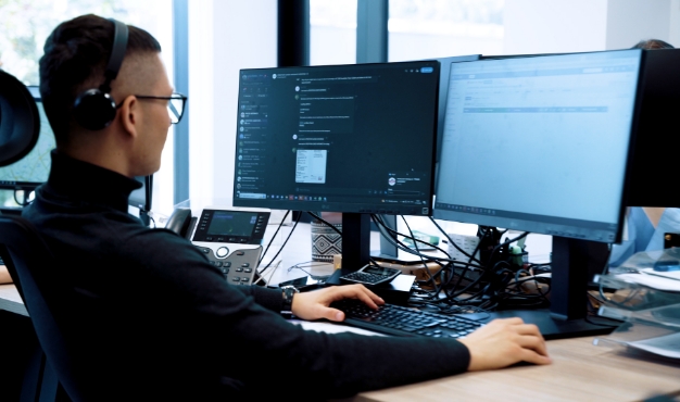 Logistics specialist coordinating transport services at a workstation